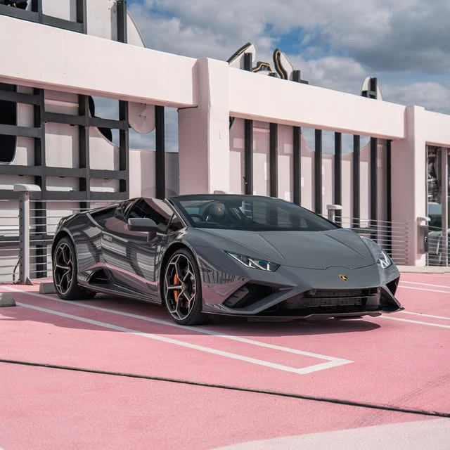 Grey sports car against a pink architectural setting, from @pugachev_service on Instagram