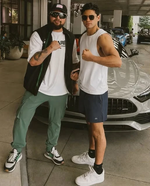 Two men beside a silver car, from @pugachev_service on Instagram